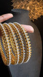 Set of 4 Pearl Look-Alike Bangles - BUDGET